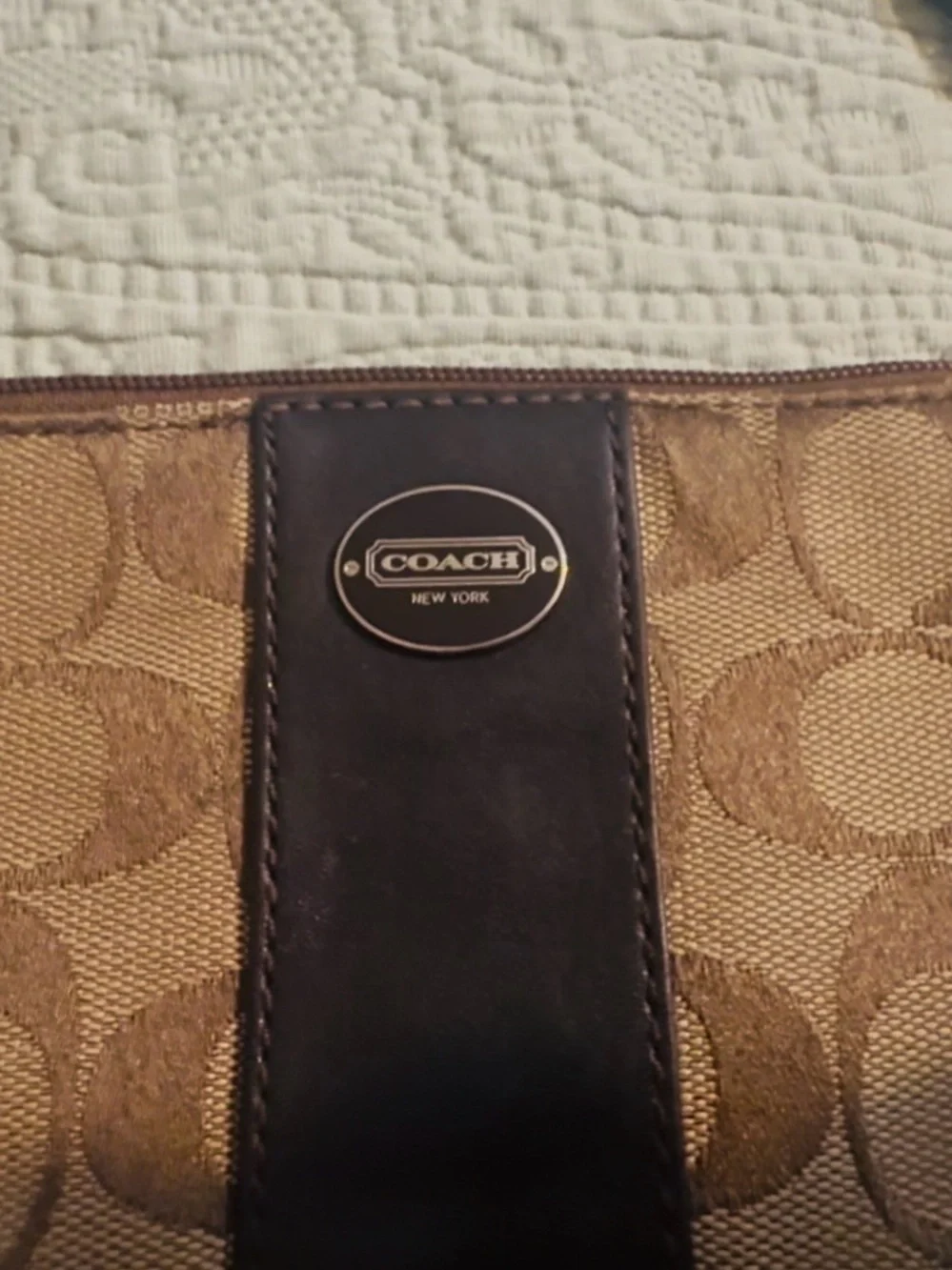 Coach Signature tan/brown canvas wristlet, w/strap, good/used.